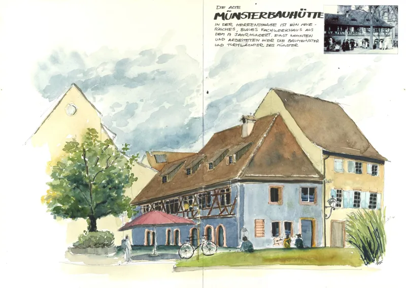 Das blaue Fachwerkhaus der Münsterbauhütte mit Terrasse und Fahrrad, in Tinte und Aquarell auf einer Doppelseite.